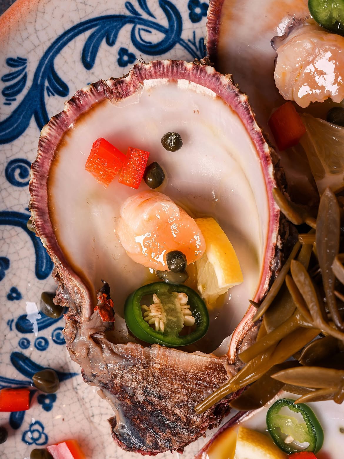 Shrimp, capers and chilli served in a large shell