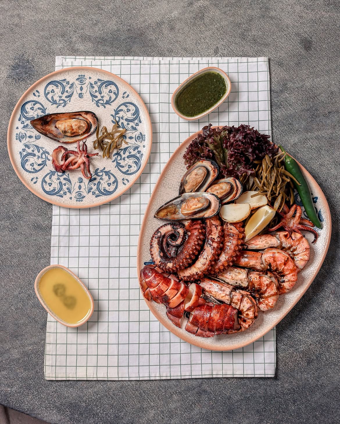 Seafood platter of octopus, mussels and prawns straight off the grill